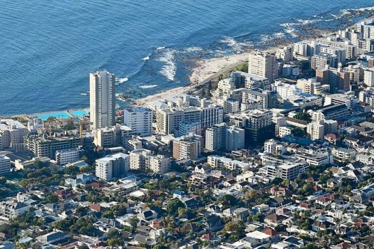 Breathtaking aerial view of a coastal city with the ocean in the background.