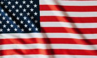 Flying national flag of United Stated of America with red and white stripes and white stars on blue square
